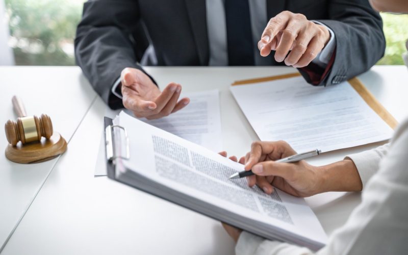 Lawyer Legal counsel presents to the client a signed contract with gavel and legal law. justice